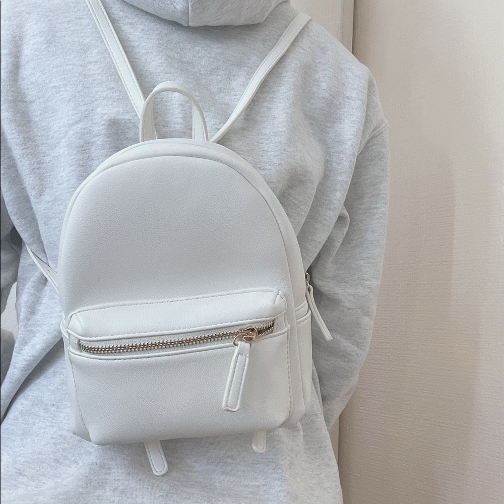 small white backpack